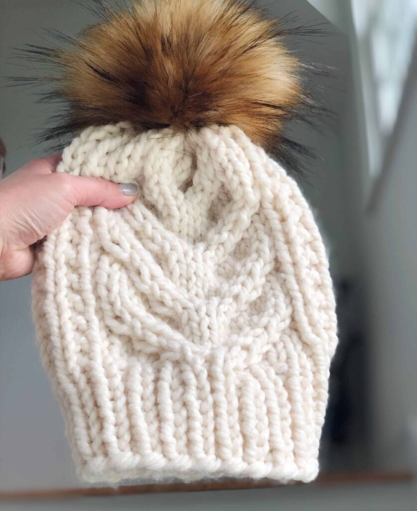 Free cable hat knitting pattern using Lion Brands wool-ease thick and quick